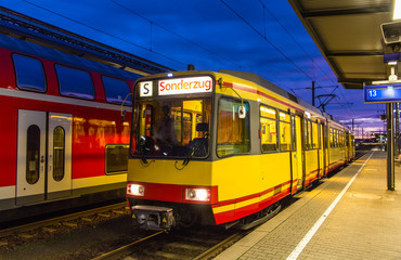 Fototapeta na wymiar Tram-train at Karlsruhe railway station - Germany