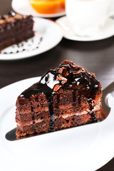 Yummy chocolate cake served on table, close-up