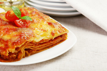 Portion of tasty lasagna on table