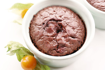 Hot chocolate pudding with fondant centre on white table