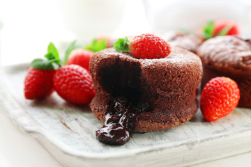 Hot chocolate pudding with fondant centre with strawberries,