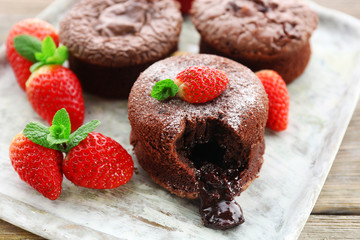 Hot chocolate pudding with fondant centre with strawberries,