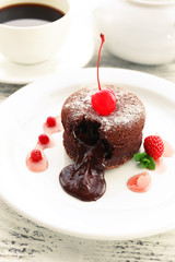 Hot chocolate pudding with fondant centre on plate, close-up