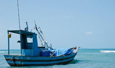 Naklejka premium Small blue fishing boat
