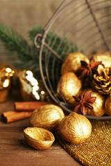 Obraz premium Beautiful Christmas composition with golden walnuts,