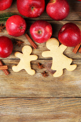Christmas cookies and fruits on wooden table
