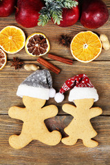 Fototapeta na wymiar Christmas cookies and fruits on wooden table