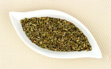 Dehydrated and dried basil leaves chopped in gourmet dish
