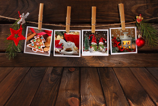 empty wooden floor and christmas photos hanging on twine
