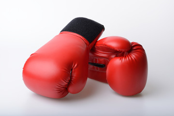Pair of red leather boxing gloves isolated on white