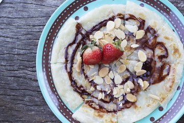 Indian Chapati Breads or roti dough and strawberry fruit.
