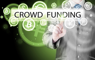 Businessman pushes virtual crowd funding button