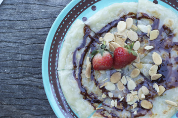 Indian Chapati Breads or roti dough and strawberry fruit.