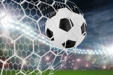 Fototapeta premium soccer ball in goal net