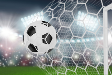 Obraz premium soccer ball in goal net