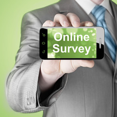 Businessman showing business concept on smartphone