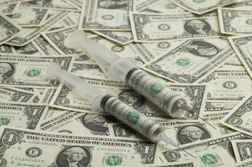 Syringe and dollar-bill