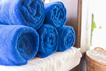 Fototapeta na wymiar folded blue towel for spa massage