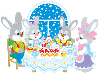 Rabbits at the holiday table with a Christmas cake