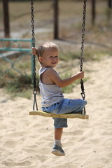 little boy on a swing