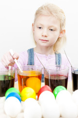 portrait of little girl during Easter eggs'' coloration