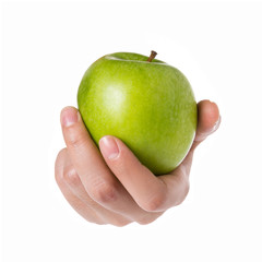 Female hand holding green apple isolated on white.