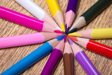 Naklejka premium close up of many colorful drawing pencils on wooden table