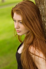 Beautiful young woman in park