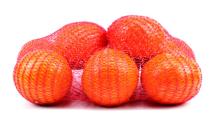 Fresh tangerines in mesh sack isolated on white background