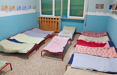 dormitory with beds for children in the early childhood school