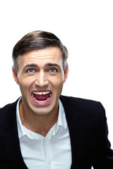 Angry businessman shouting isolated on a white background