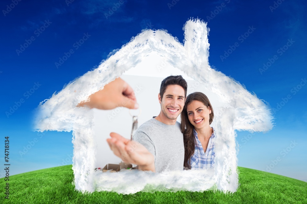 Poster Composite image of happy man being given a house key