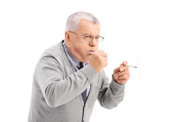 Senior smoking a cigar and coughing