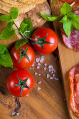 fresh organic tomatoes with basil and rock salt