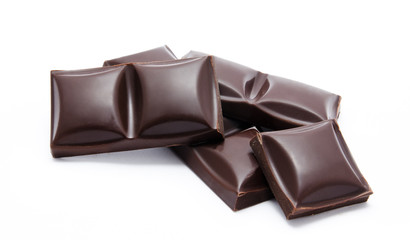 Dark chocolate bars stack with crumbs isolated