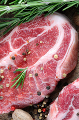 raw marble steak with herbs and spices