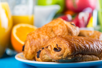 Fresh croissant with orange juice
