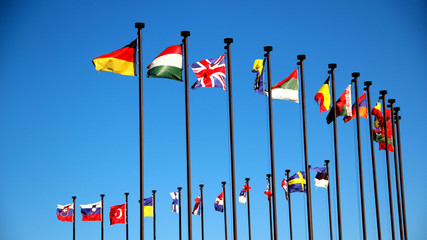 international flags against the sky - 74725534