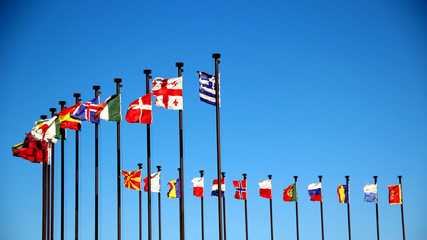 international flags against the sky - 74725543