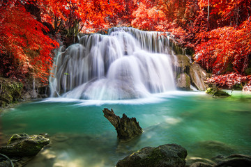 Fototapeta na wymiar Beautiful waterfall in autumn forest