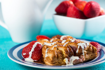 Continental breakfast with croissant and fresh strawberries