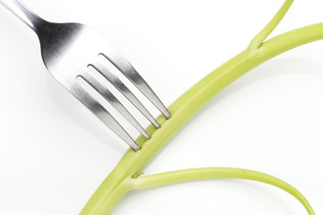 morning glory, vegetable, with fork