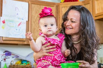 Fototapeta premium Mother Smiles at Baby