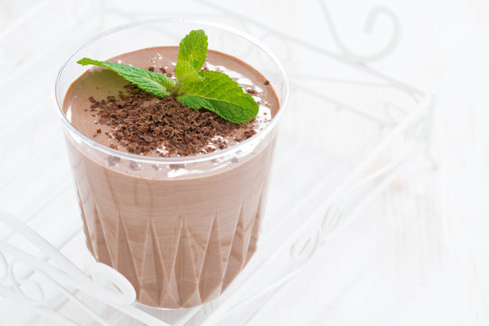 chocolate milkshake in a glass on white background