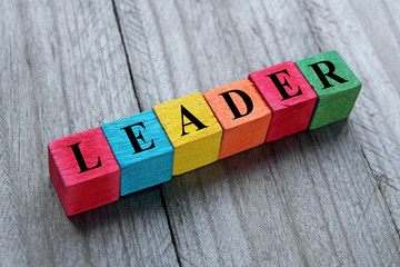 concept of leader word on colorful wooden cubes
