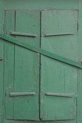closed old green window shutter