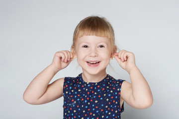 portrait of little cute girl grimacing