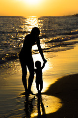 Silhouette mother and son
