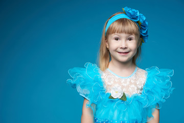 cute little girl on blue background