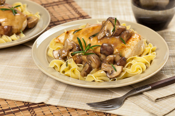 Chicken Marsala with Mushrooms and pasta. Selective focus